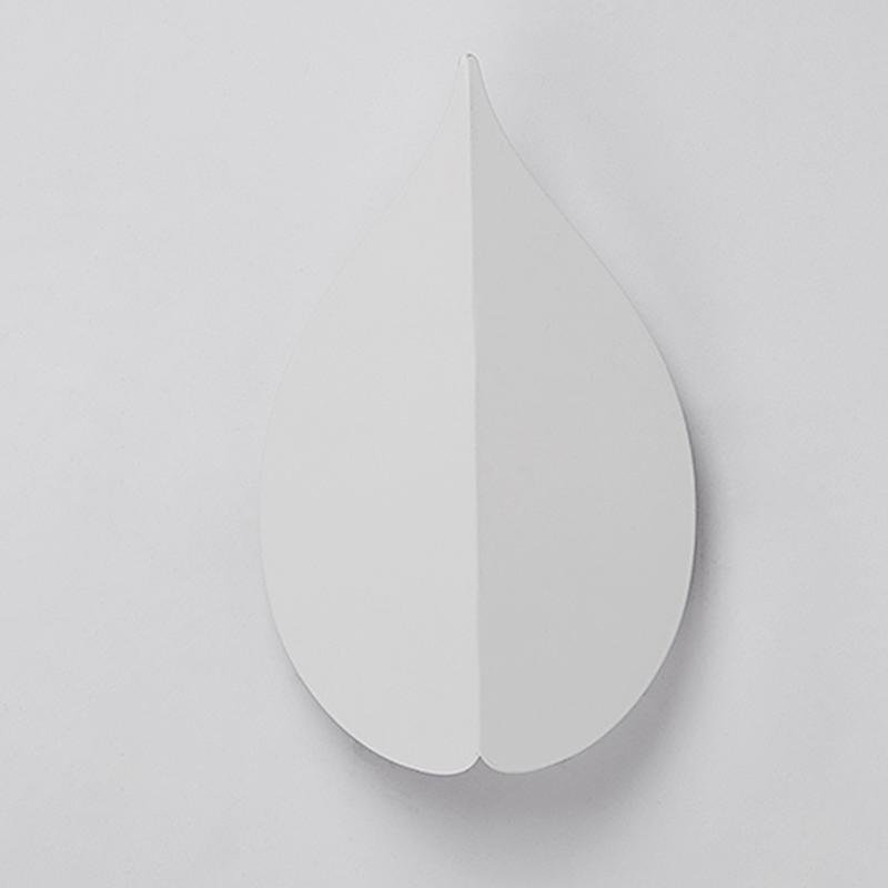 modern leaf shaped wall sconces in soft warm white