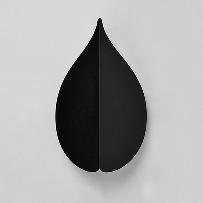 modern leaf shaped wall sconces in soft warm white
