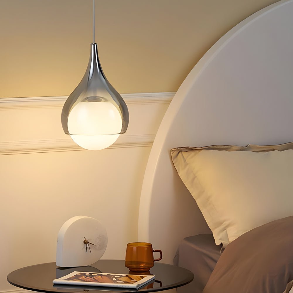 adjustable height modern teardrop glass pendant light with a single droplet