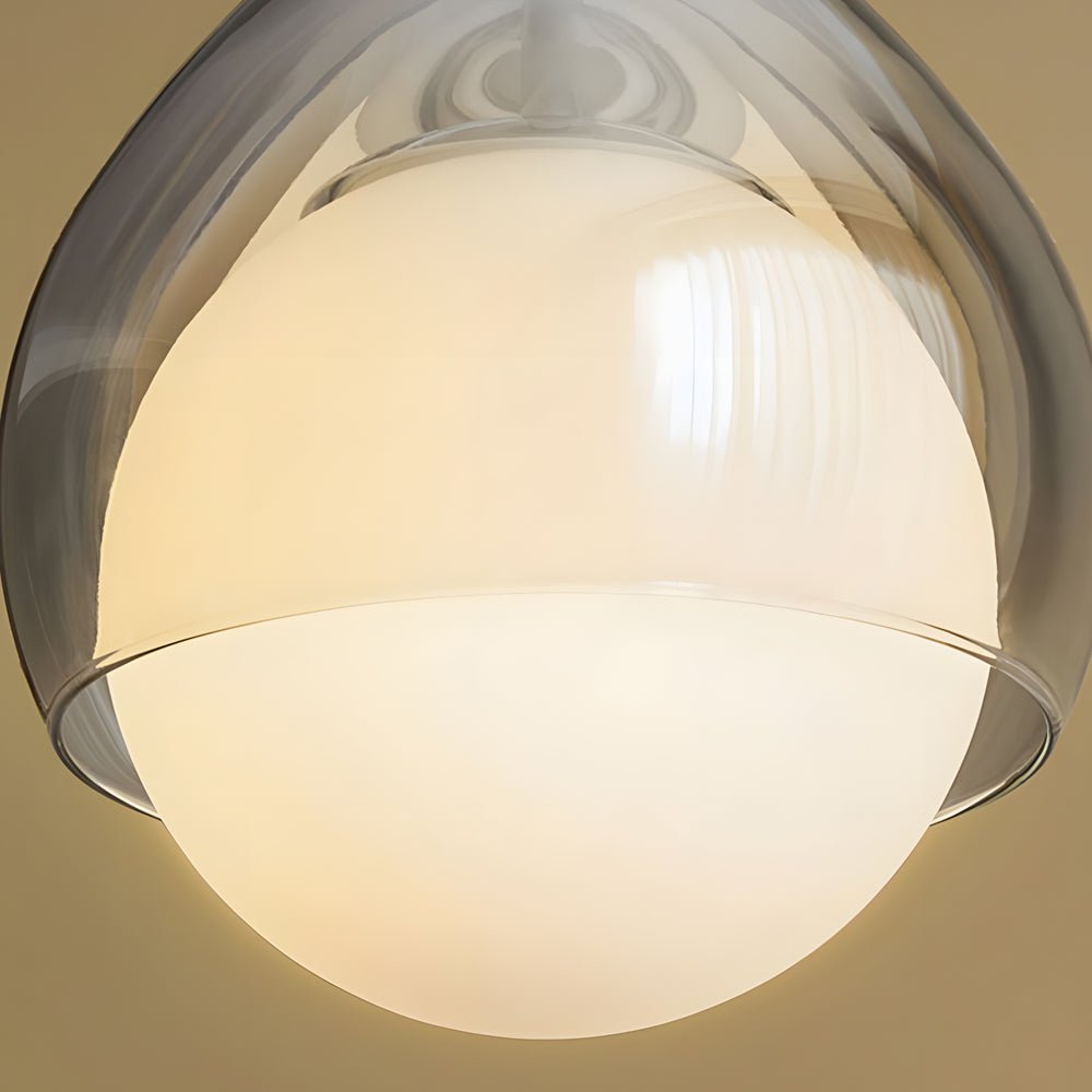 adjustable height modern teardrop glass pendant light with a single droplet