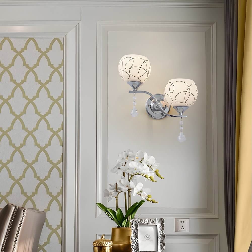 contemporary 2 light wall sconce in open sphere design with crystal pendants
