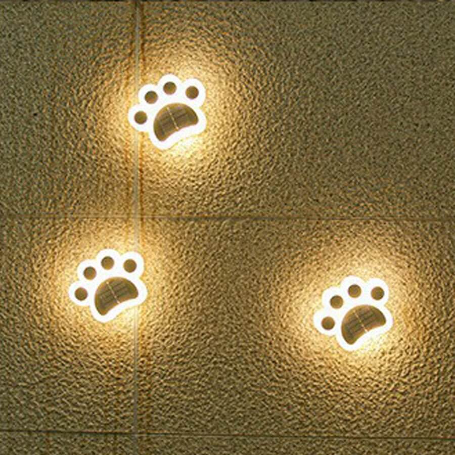 contemporary solar powered led animal paw lights for step and stair illumination