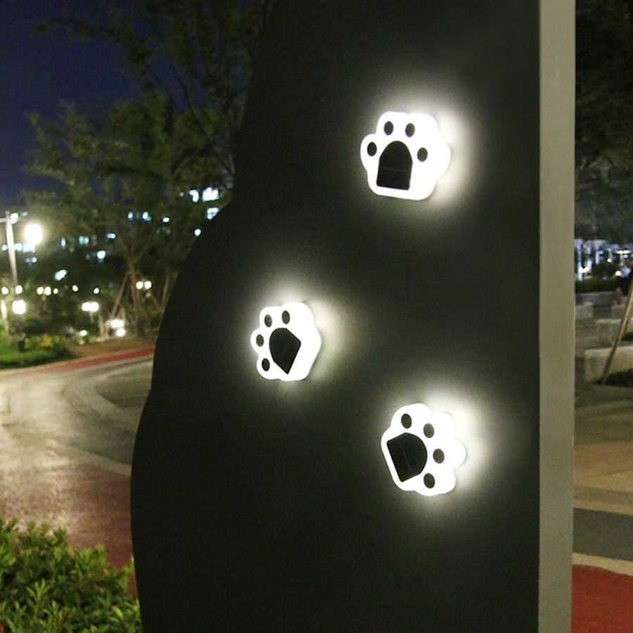 contemporary solar powered led animal paw lights for step and stair illumination