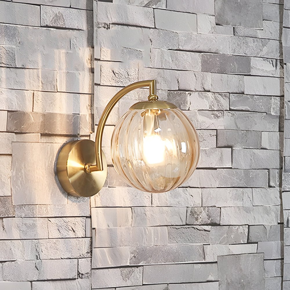 curved arm wall sconce with a single light and ball rib glass shade
