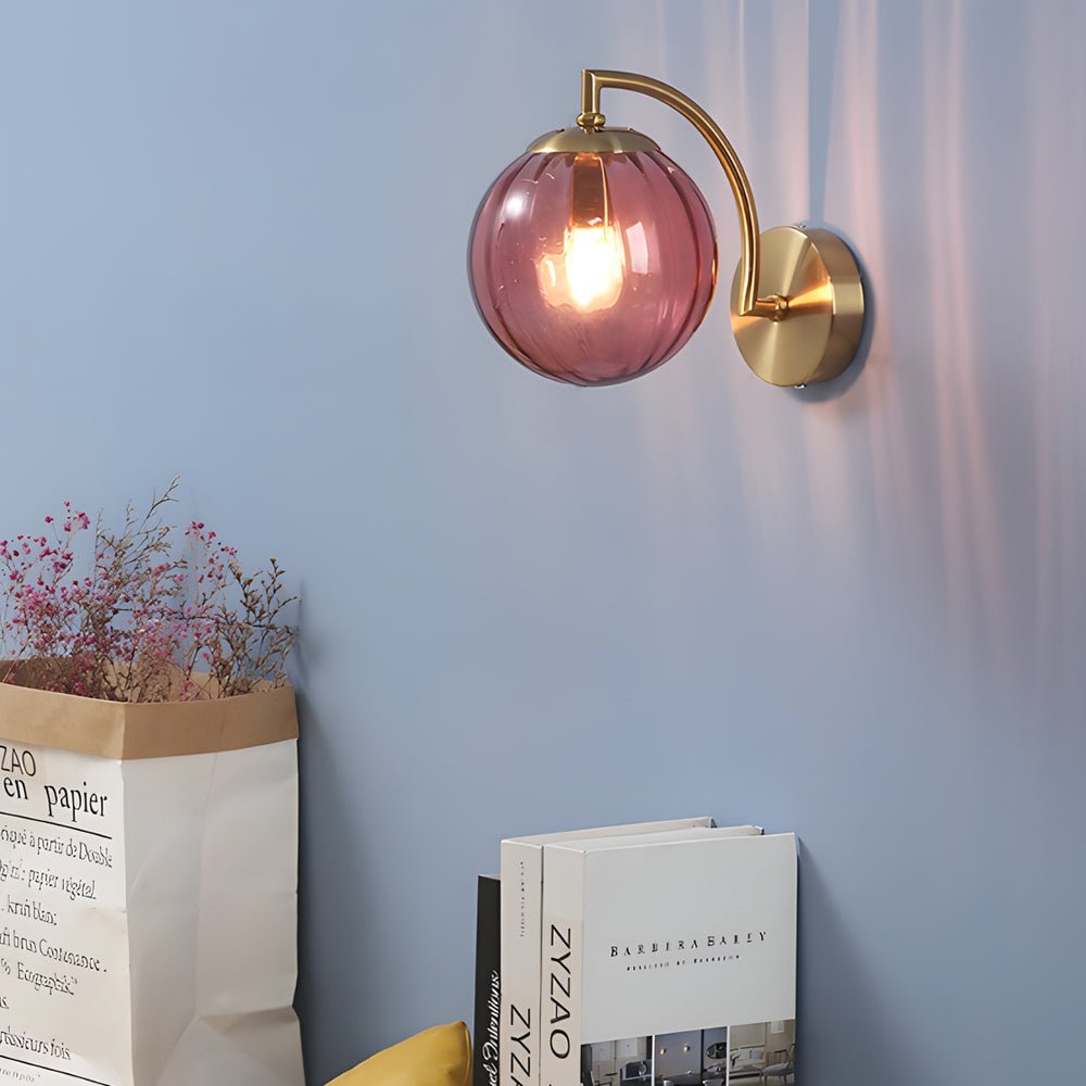 curved arm wall sconce with a single light and ball rib glass shade