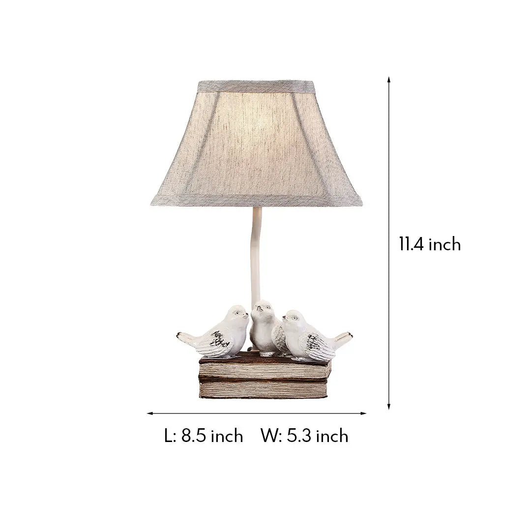 Fabric Light Table Lamp Featuring a Small Bird Perched on Stacked Books Luxe