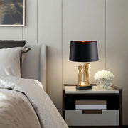 Elegant Drum Shade Lamp with Sculptural Gold and Black Base Luxe