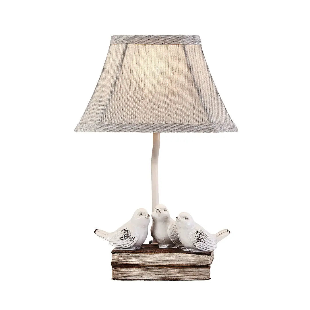 Fabric Light Table Lamp Featuring a Small Bird Perched on Stacked Books Luxe