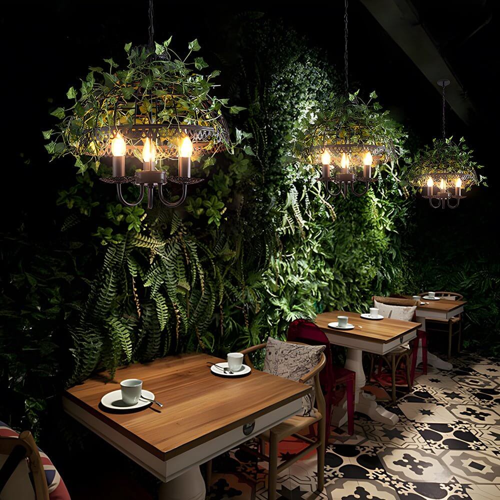 iron cage pendant light inspired by the enchanted forest adorned with vines