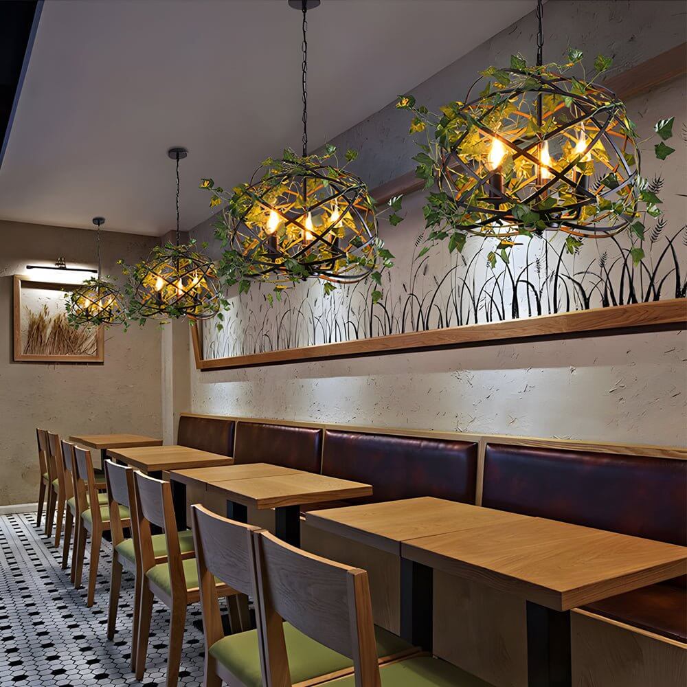 iron cage pendant light inspired by the enchanted forest adorned with vines