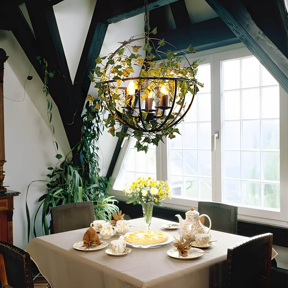 iron cage pendant light inspired by the enchanted forest adorned with vines