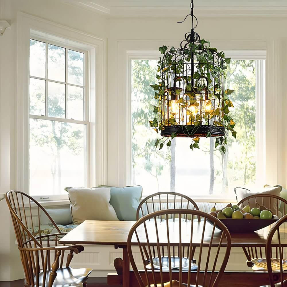 iron cage pendant light inspired by the enchanted forest adorned with vines