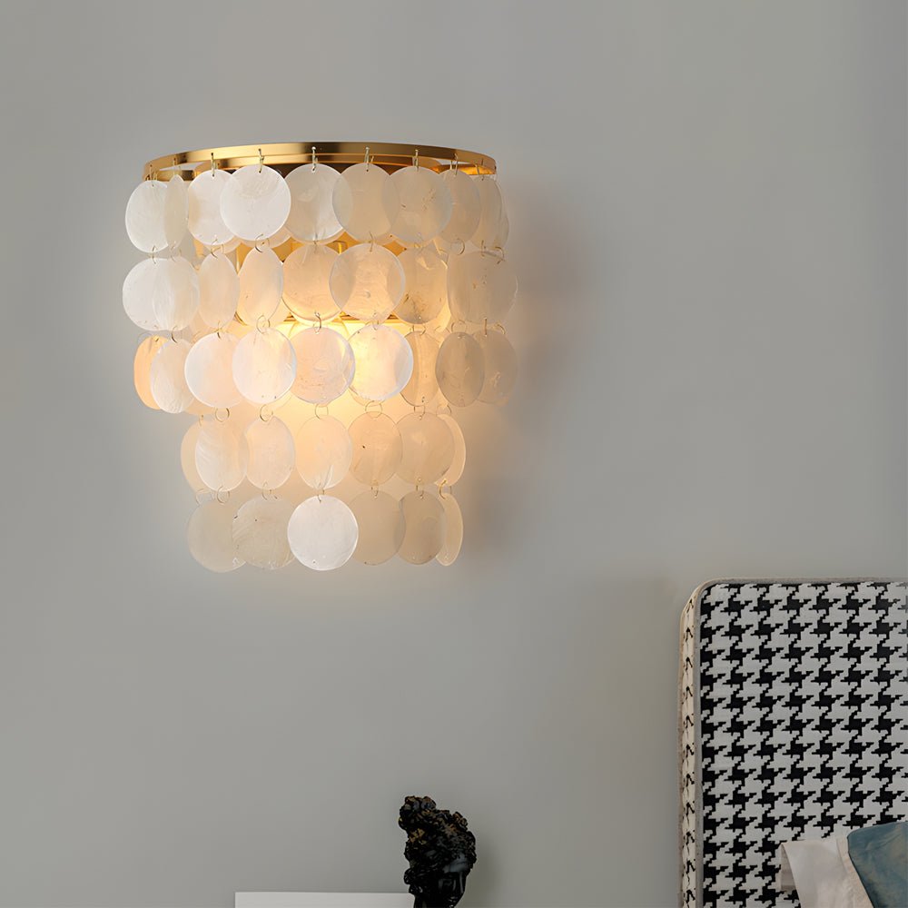 led metallic wall sconce with goldchrome finish and coastal capiz shell for bedside lighting