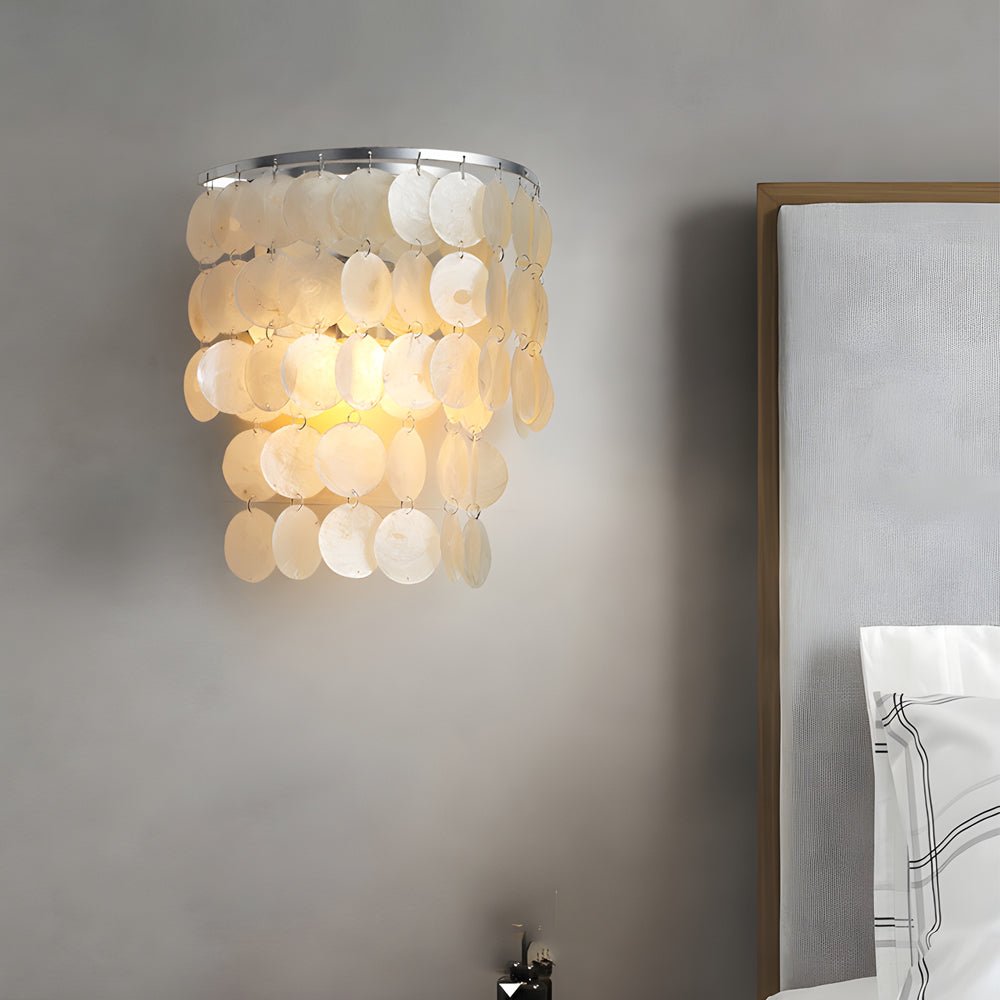 led metallic wall sconce with goldchrome finish and coastal capiz shell for bedside lighting