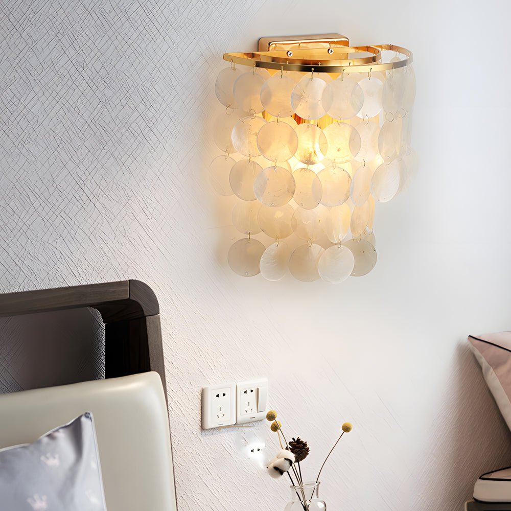 led metallic wall sconce with goldchrome finish and coastal capiz shell for bedside lighting
