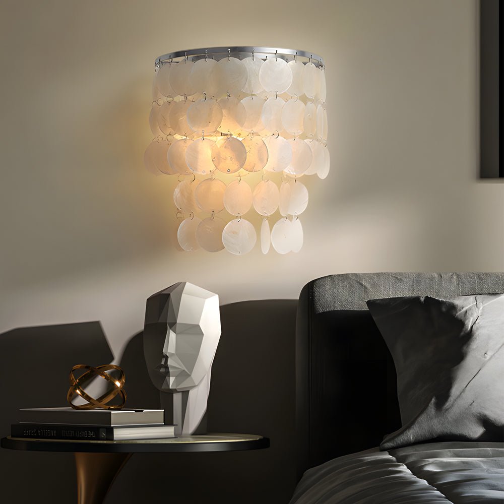 led metallic wall sconce with goldchrome finish and coastal capiz shell for bedside lighting