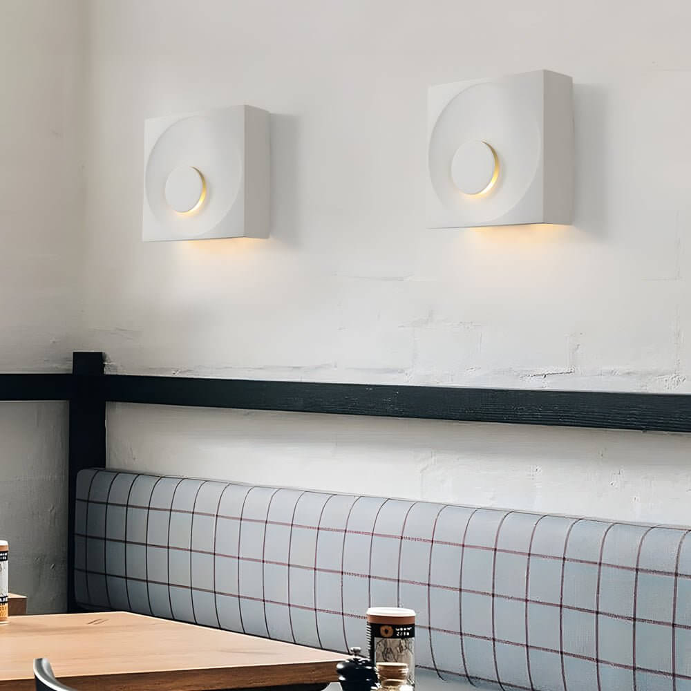 led wall light with frosted cement eclipse design