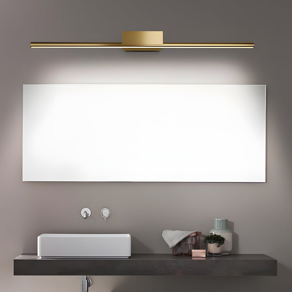 linear led vanity light in brushed brass with slim cylinder design for bathrooms
