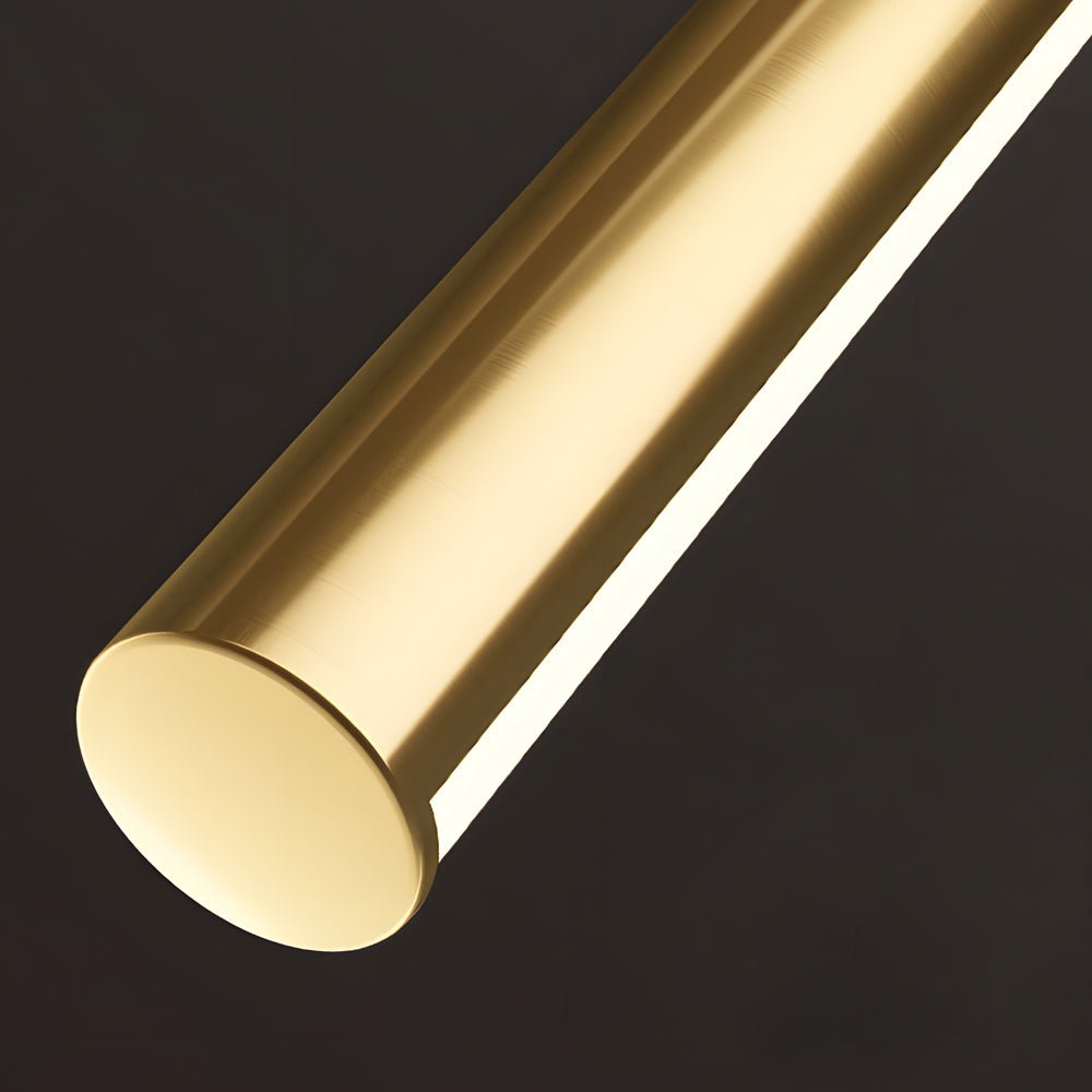 linear led vanity light in brushed brass with slim cylinder design for bathrooms