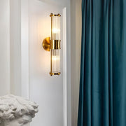 modern 12 light wall sconce in chrome and gold with clear cylinder glass shade