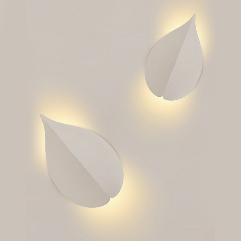 modern leaf shaped wall sconces in soft warm white