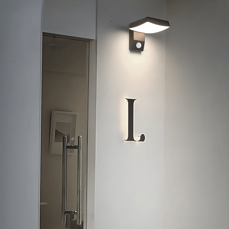 rotatable black outdoor wall light with motion sensor