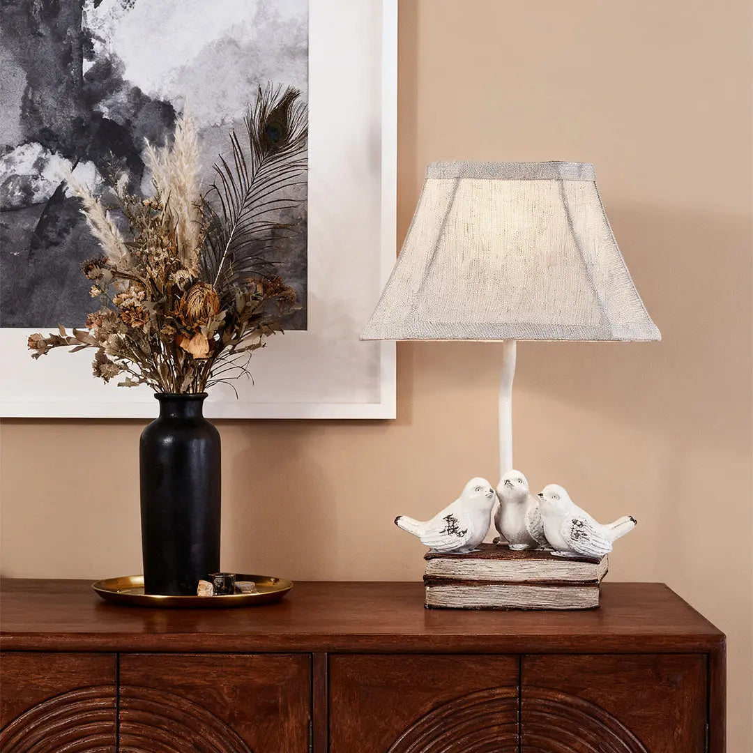 Fabric Light Table Lamp Featuring a Small Bird Perched on Stacked Books Luxe