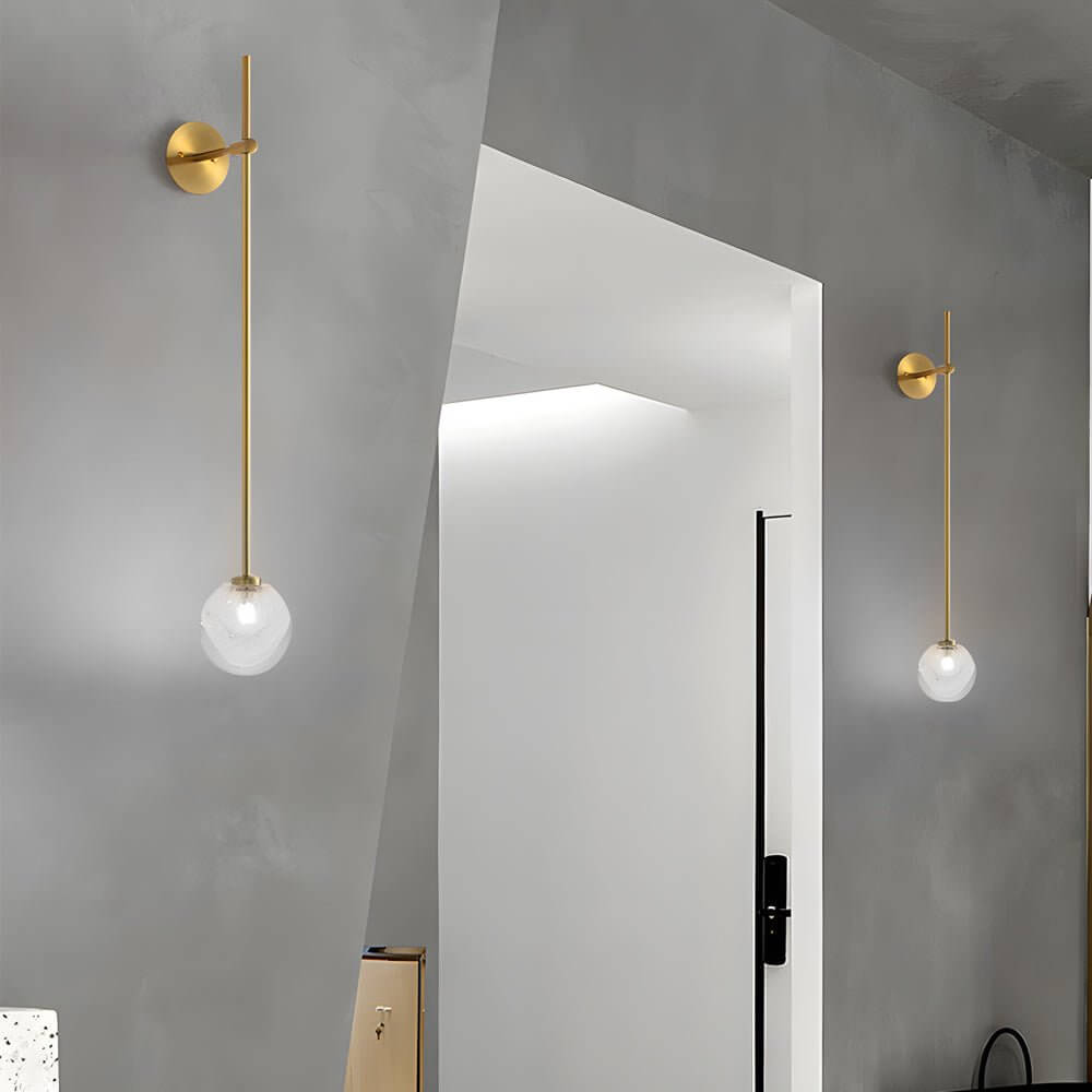 slim wall light with a single glass bubble globe