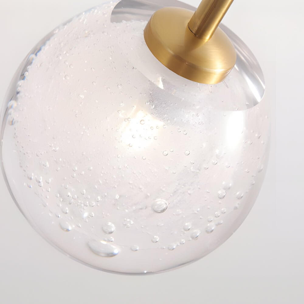 slim wall light with a single glass bubble globe