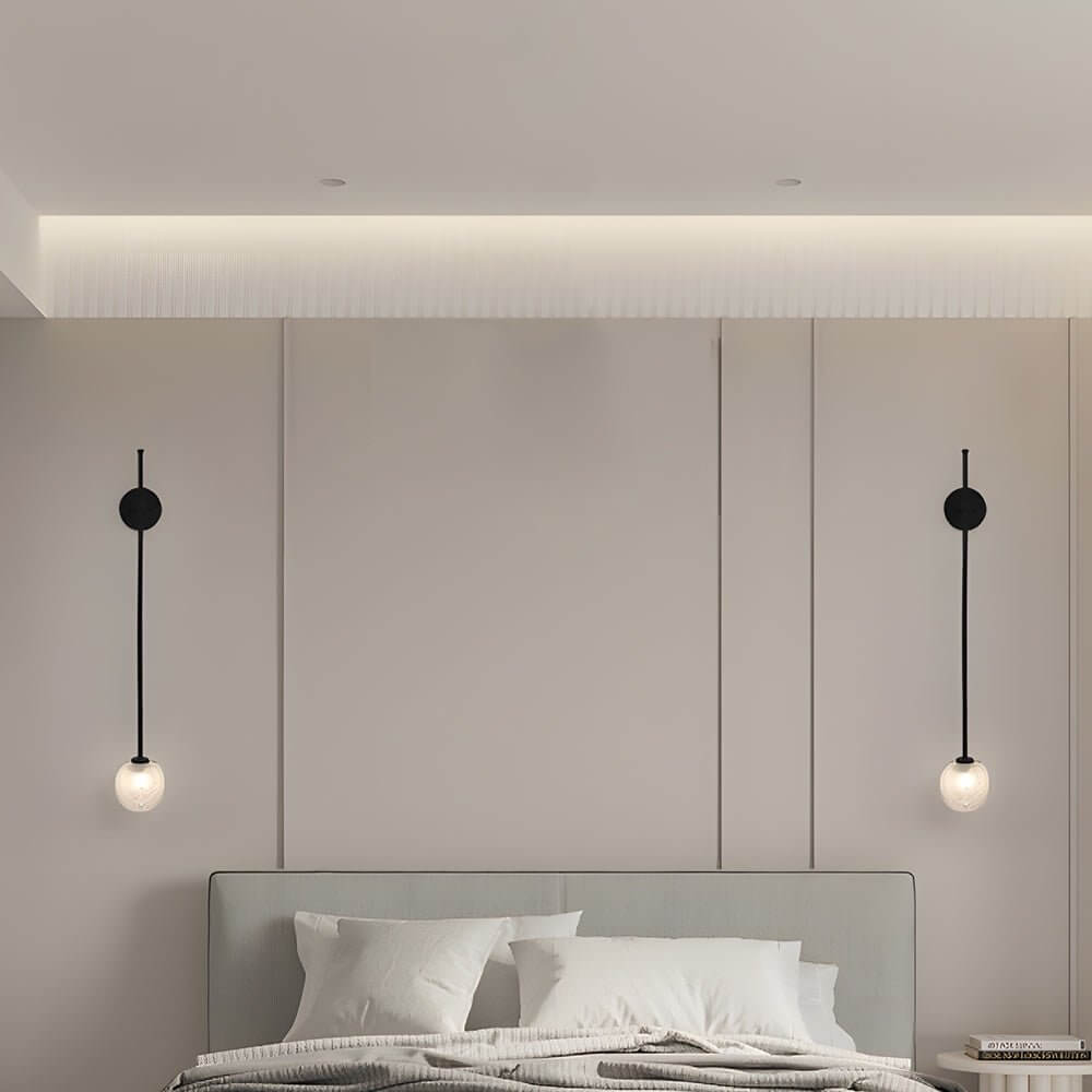 slim wall light with a single glass bubble globe