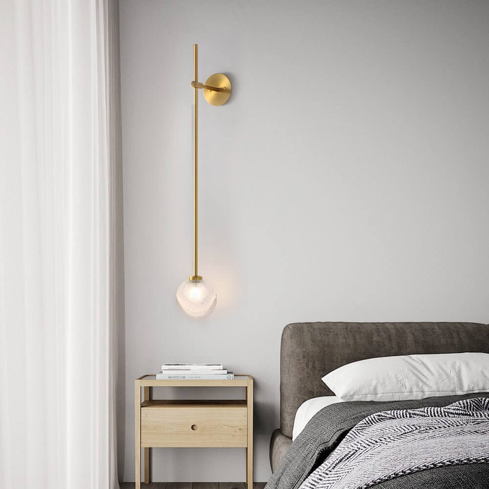 slim wall light with a single glass bubble globe