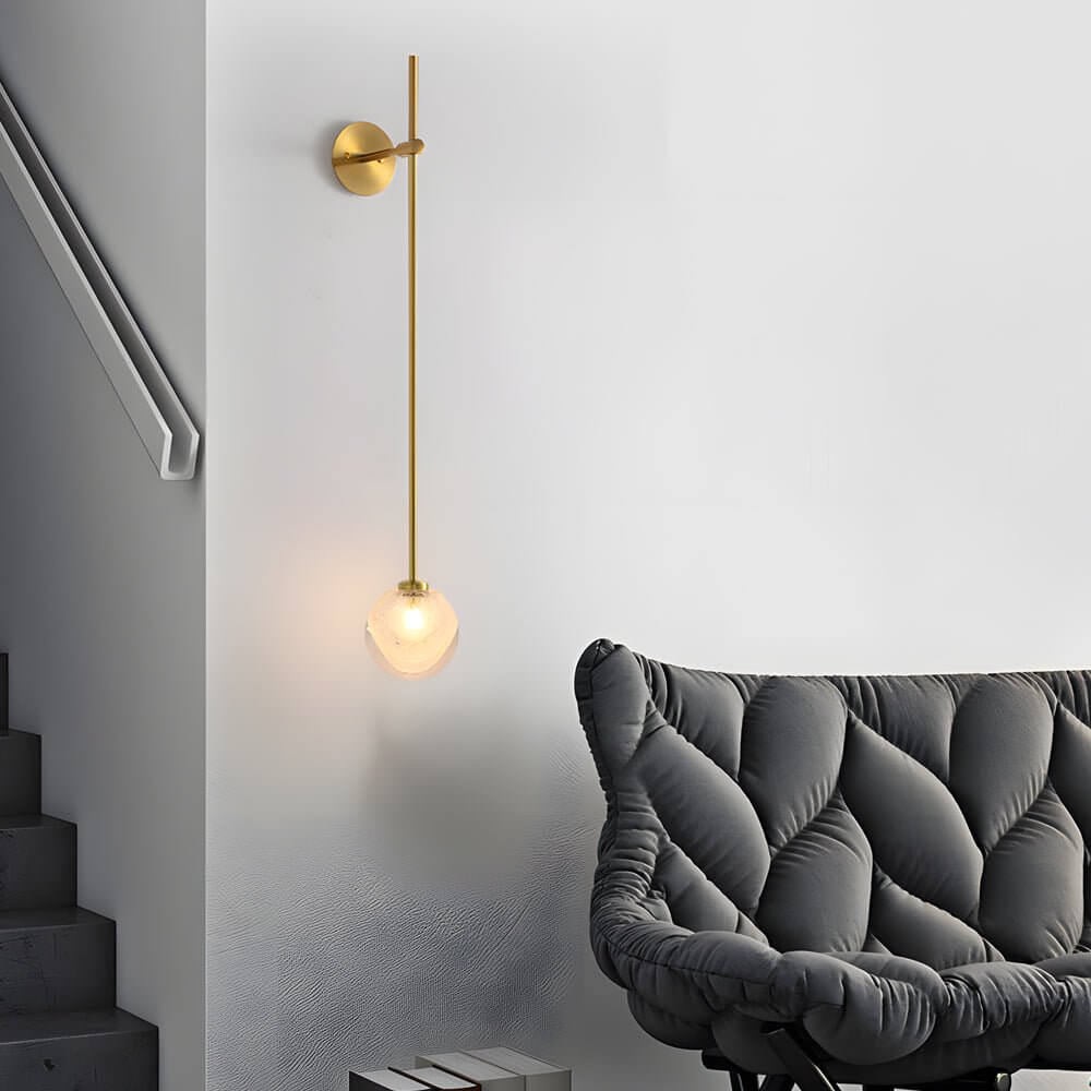 slim wall light with a single glass bubble globe