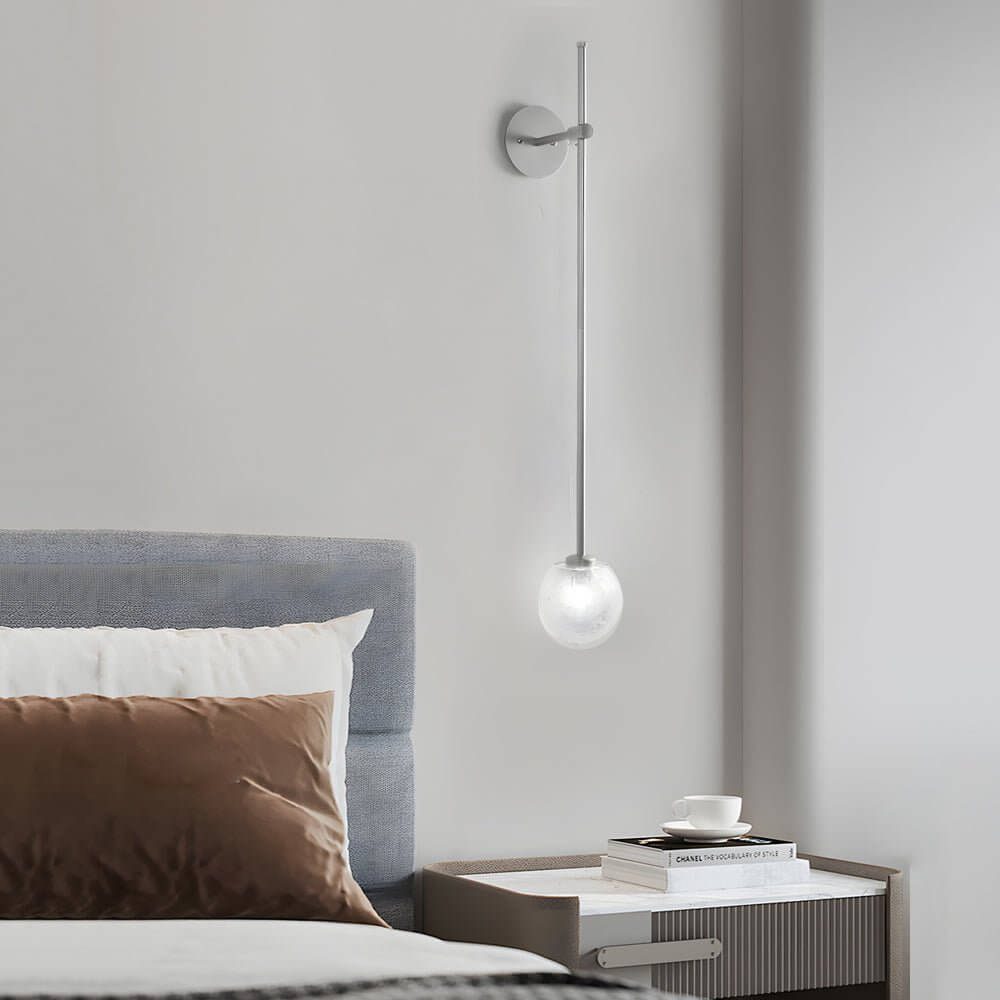 slim wall light with a single glass bubble globe