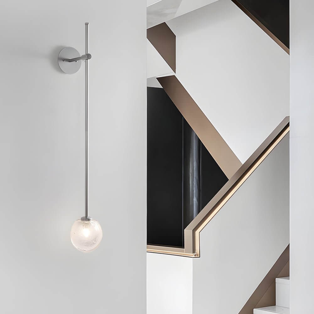 slim wall light with a single glass bubble globe