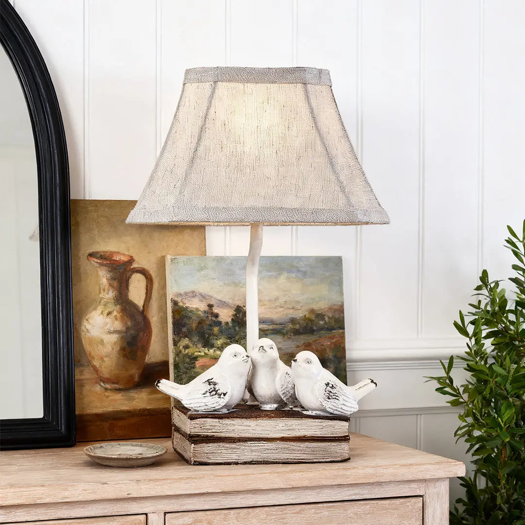 Fabric Light Table Lamp Featuring a Small Bird Perched on Stacked Books Luxe